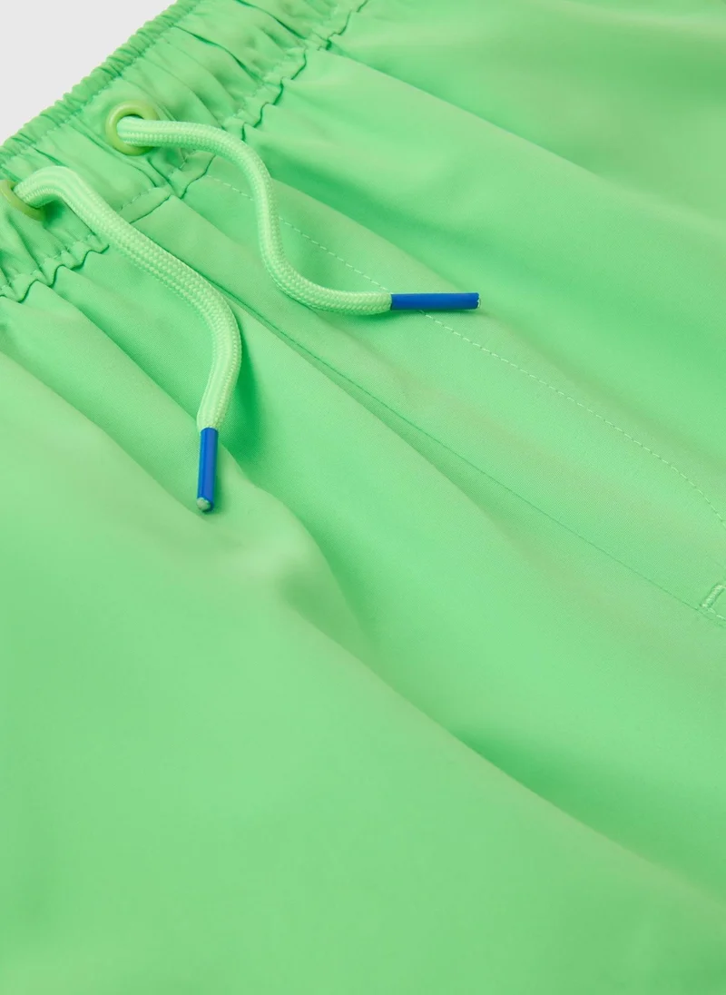 ماتلان شورت سباحة أولاد باللون الأخضر الليموني